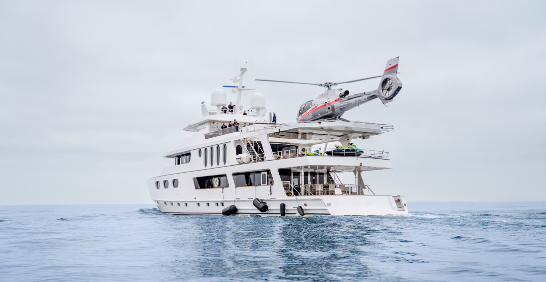 HELI-YACHT experience showcasing luxury yacht amenities and helicopter landing